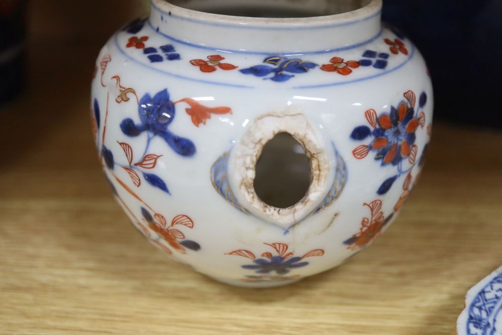 A collection of mixed Chinese and Japanese porcelain and pottery including a Nanking Cargo blue and white tea bowl, a 19th century